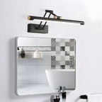 Luminaire mural LED noir et or design moderne, IP44, au-dessus d'un miroir.