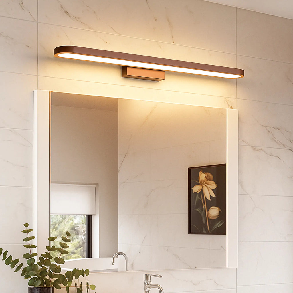 The ORLUNE HOME wooden wall light casts a warm LED glow above the mirror.