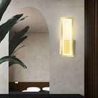 Warm LED wall light illuminates the space with a minimalist, modern glow.