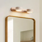 Applique murale LED en bois clair travertin avec deux cylindres blancs, style minimaliste.