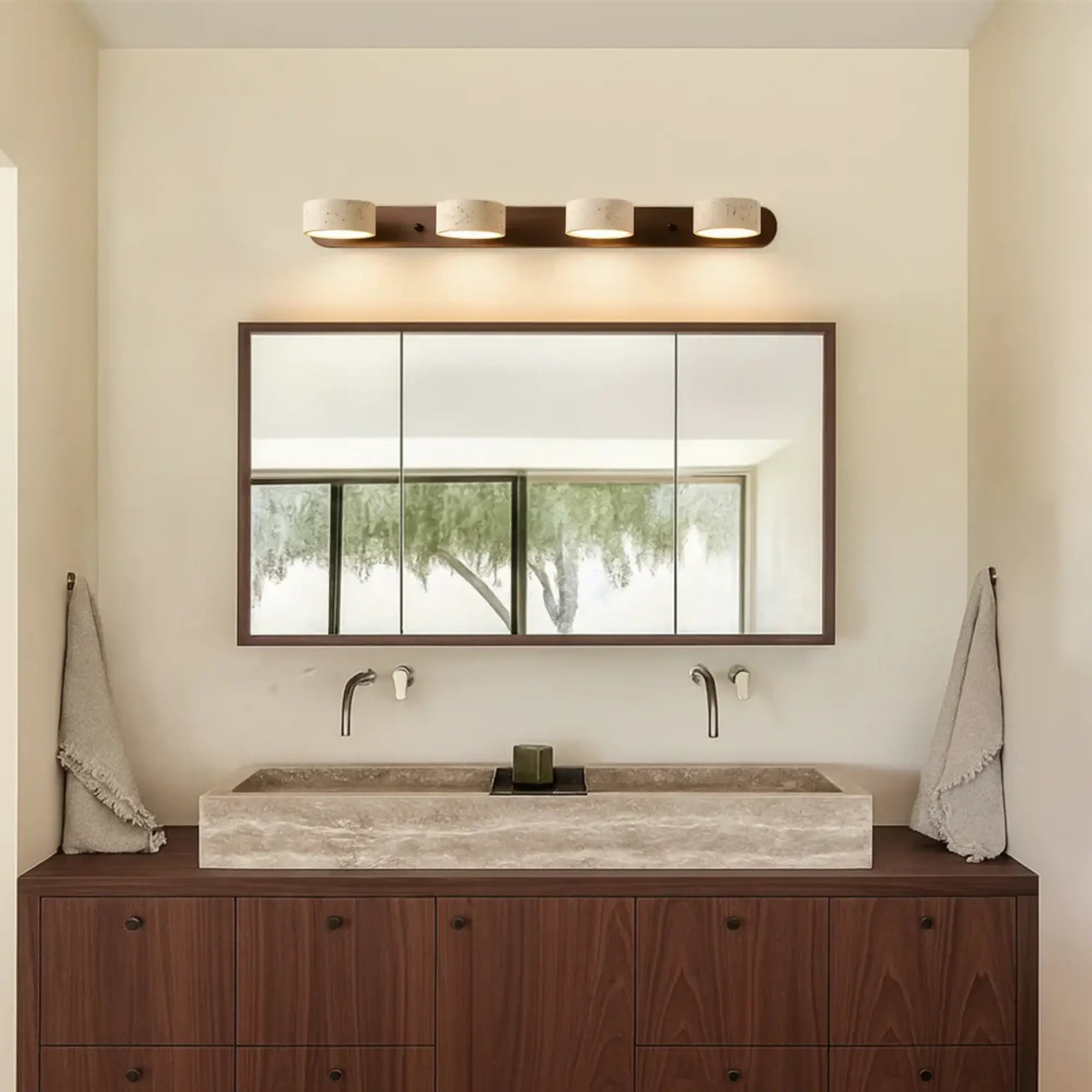 The ORLUNE HOME LED wall light casts a warm, minimalist glow above the mirror.