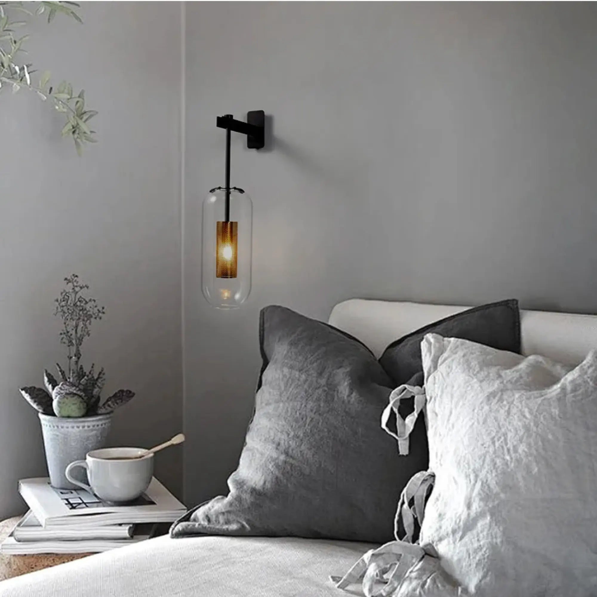 The ORLUNE HOME Vertical Glass Wall Light creates a soothing, inviting ambiance with its warm glow.