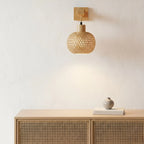 The ORLUNE HOME Natural Rattan Style Wooden Wall Light casts a warm, inviting glow.