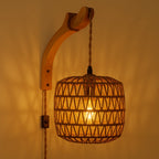 This rattan wall light creates a cozy atmosphere with soft, decorative shadow patterns.