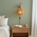 ORLUNE HOME rattan wall light with wood base fills the room with a warm, inviting glow.