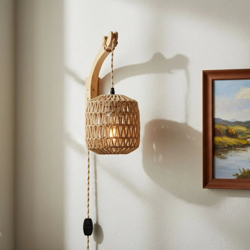 This rattan wall light with wood base creates unique shadows and cozy illumination.