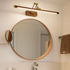 ORLUNE HOME Linear LED Wooden Wall Light in Gold White Brass brightens the bathroom.