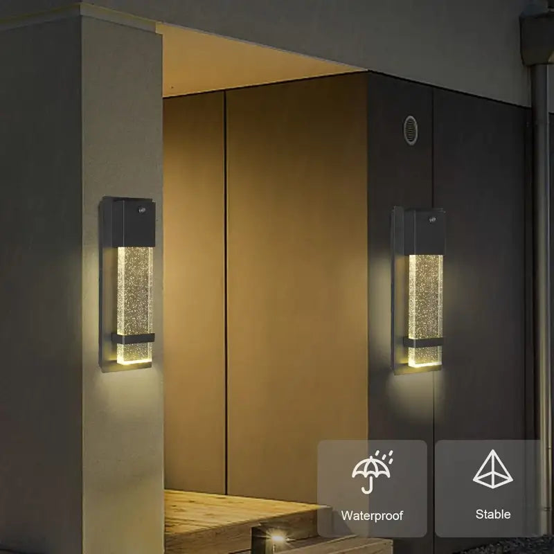 Black aluminum outdoor wall sconce with integrated LED, bubbled glass diffuser, waterproof, modern style.
