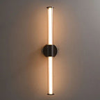 Black circular base with two vertical cylindrical LED bulbs, both ends emit a warm glow.