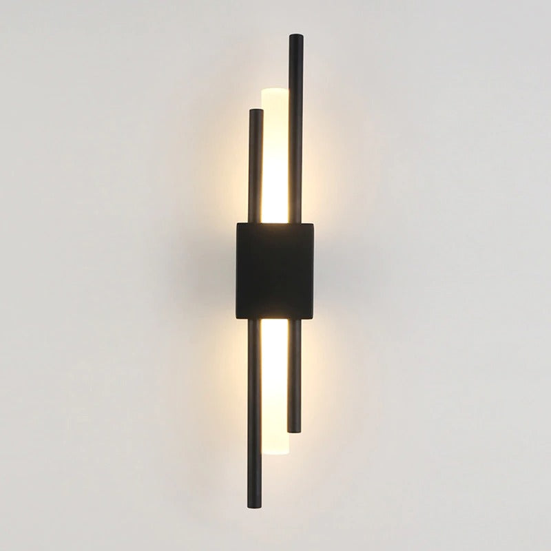 Black rectangular base with four vertical rods: two black, two glowing gold; sleek and modern.