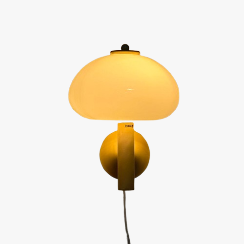 Warm yellow light softly glows through the rounded frosted mushroom glass wall shade.