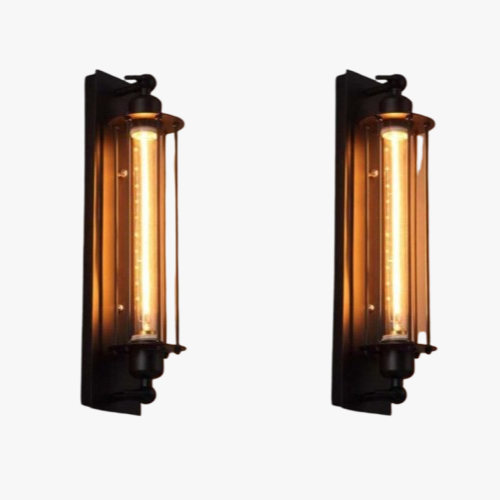 Exposed Edison bulbs and dark metal backplates emit a cozy, warm retro glow.