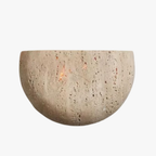Effortlessly brighten your space with this round, artistic LED wall light's subtle illumination.