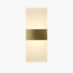 Rectangular wall sconce with frosted acrylic shade and brushed brass band, glowing warmly.