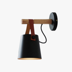 Modern wall lamp emits focused, adjustable lighting with stylish wooden and black metal elements.