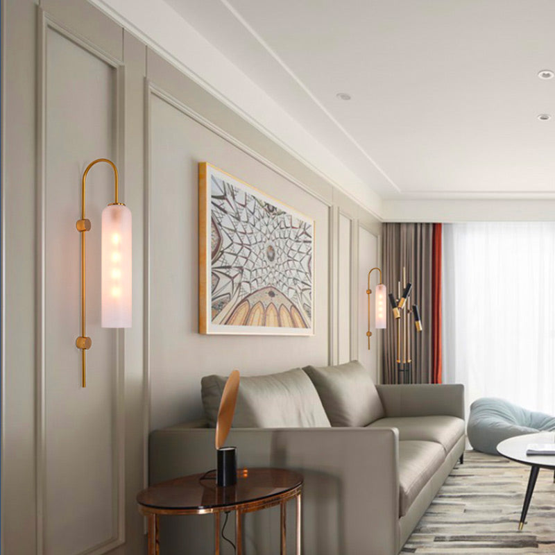Elegant modern industrial style glass wall light mounted on the wall, lit and sleek.