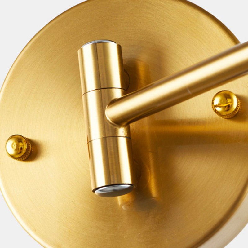 Gold aluminum wall light with round base, cylindrical arm, E27 socket, and visible gold screws.