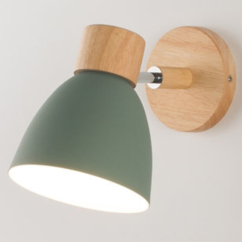 Matte green metal cone wall light with wood base and arm, 360° rotation.