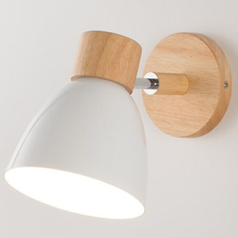 Minimalist wall light with round wood base, metal details, and white cone shade; 360° rotatable.