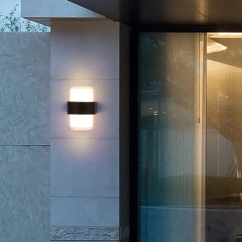 Modern outdoor wall light with PVC acrylic, built-in LED, and IP54 weather-resistant design.