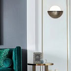 The ORLUNE HOME Retro Gold Half-Moon LED Wall Light casts a soft, elegant glow.
