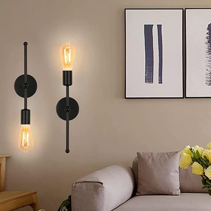 Two ORLUNE HOME black metal LED sconces provide sleek, adjustable modern lighting.