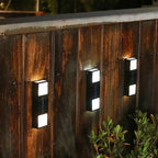 Sleek aluminum cylindrical outdoor wall lights with bright illumination, modern and minimalist design.