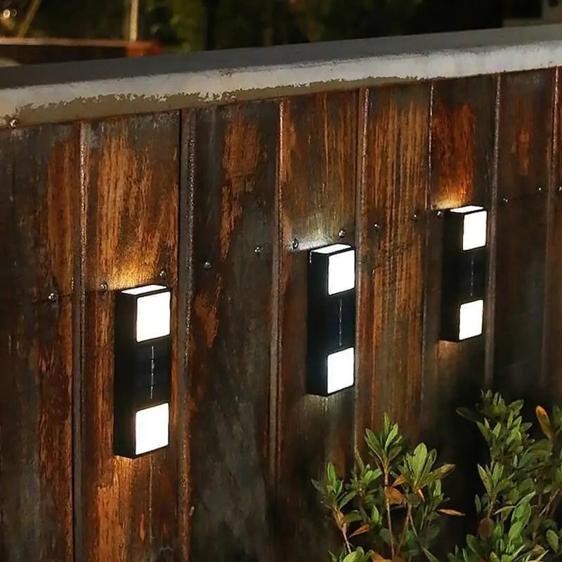 Sleek aluminum cylindrical outdoor wall lights with bright illumination, modern and minimalist design.