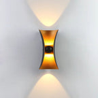 Sleek black and gold hourglass LED wall light with curved aluminum body, IP65 rated.