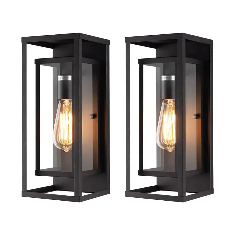 Sleek black metal outdoor wall light with clear panels and exposed Edison bulb, IP65-rated.
