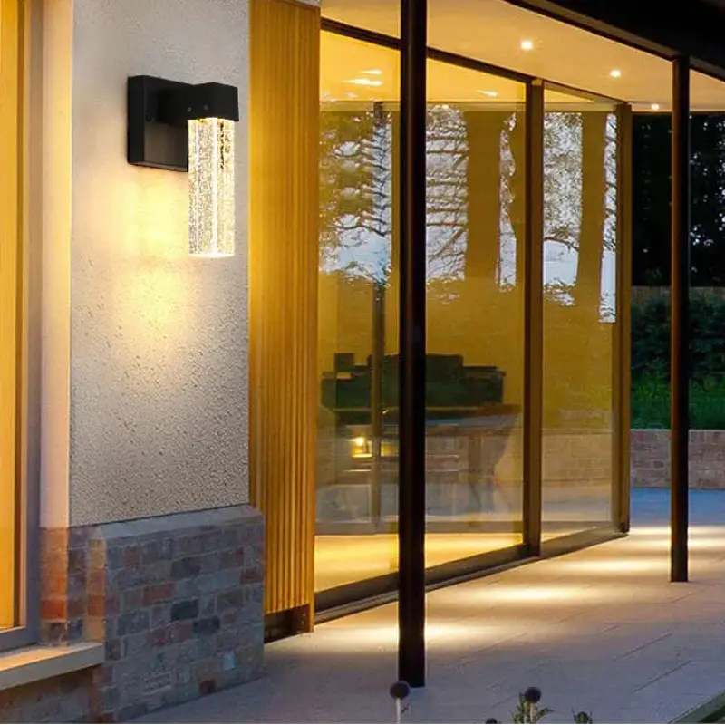Sleek crystal aluminum wall sconce with warm LED glow highlighting its modern, stylish design.