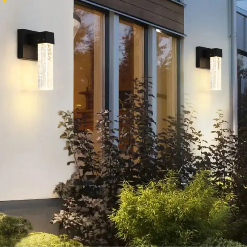 Sleek crystal aluminum wall sconces with integrated LEDs emit a soft, modern glow.