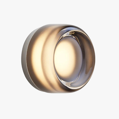 Sleek round blown glass wall light with glowing LED, soft ambient illumination, elegant style.