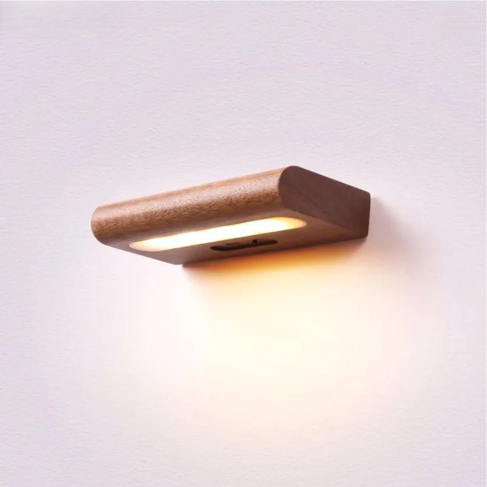 Slim wooden solar LED wall light with warm, soft downward glow; modern and natural style.