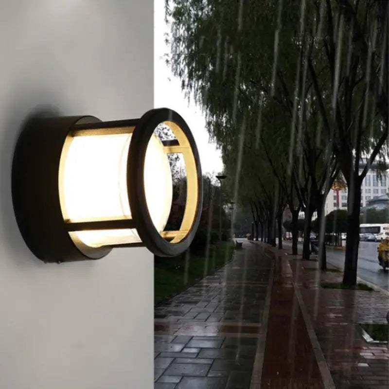 The Outdoor wall light with PVC acrylic and LED emits a bright glow on rainy days.