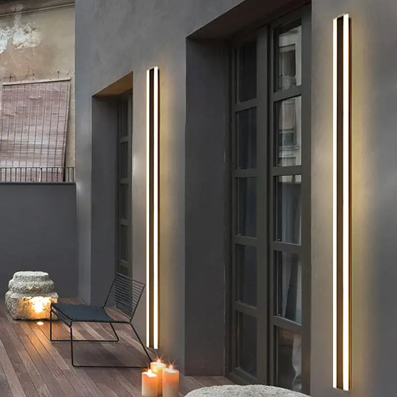 Two Extra Large waterproof black aluminum outdoor wall lights mounted on modern dark walls.