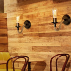 Two industrial vintage hemp stairway wall sconces with exposed bulbs on a wood plank wall.
