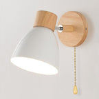 Wall light with wooden base, white conical shade, gold pull chain, and 360° rotation.