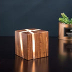 Wooden Cube LED Wall Light with glowing resin inlays highlighting its minimalist design.
