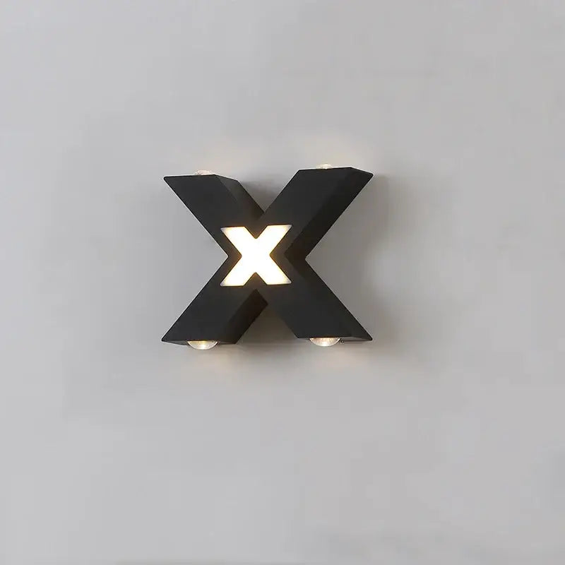 X-shaped LED black aluminum wall light with glowing center, IP65 waterproof-rated design.
