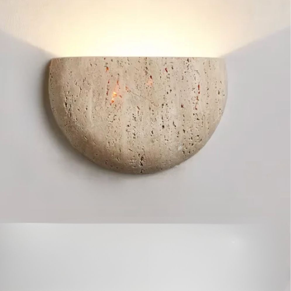 Warm LED light glows upward, gently illuminating walls with soft, dotted reflections.