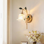 The ORLUNE HOME Elegant Wall Light glows warmly, golden leaves illuminating the wall beautifully.