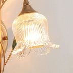 Radiant golden leaves and ribbed glass shade disperse a warm, sophisticated glow.