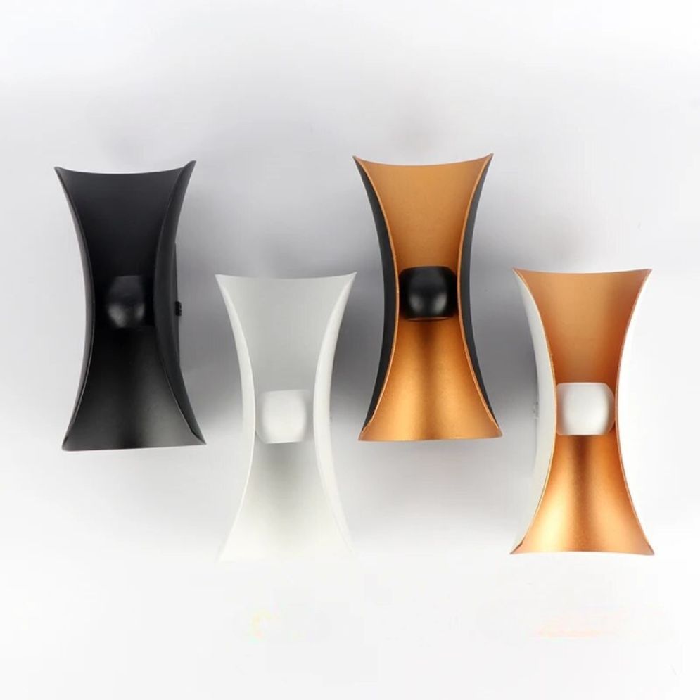 Four modern wall lights in gold, black, and white offer stylish, minimalist illumination.