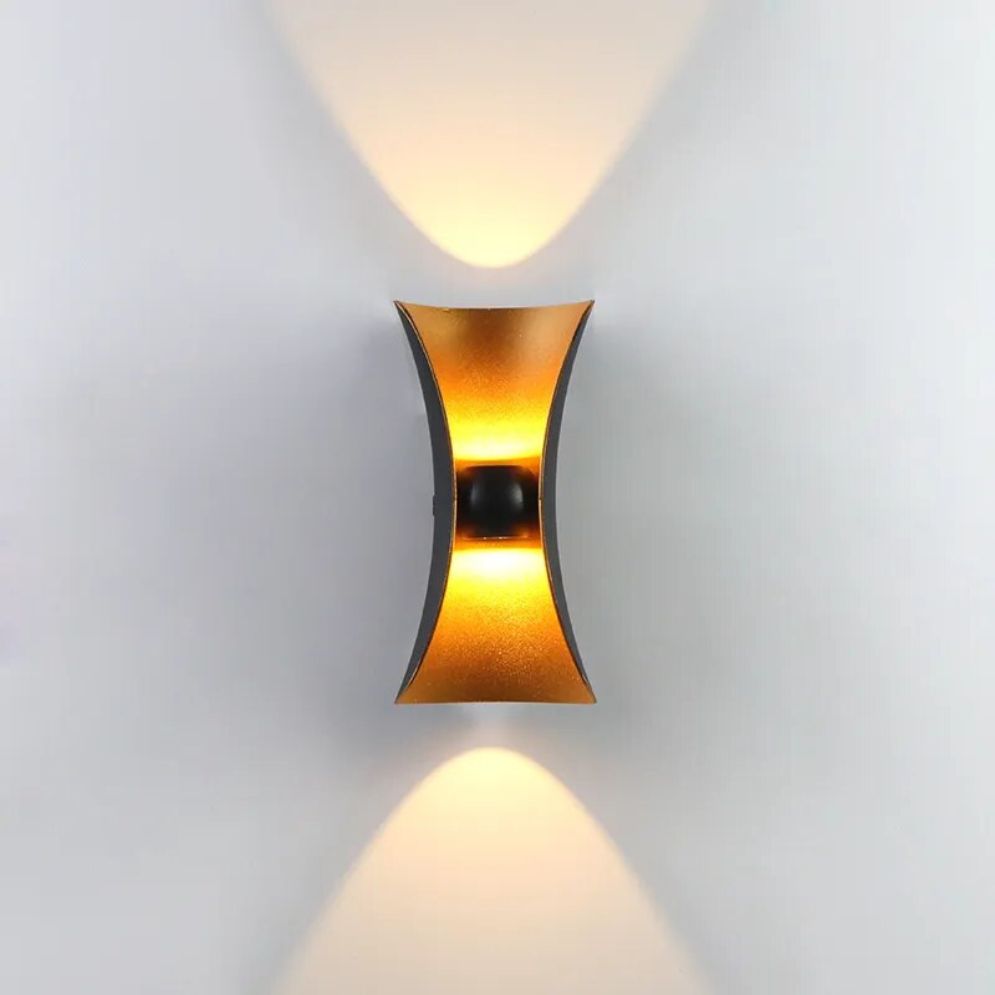 Warm LED wall light casts soft, symmetrical up-and-down light for modern ambiance.