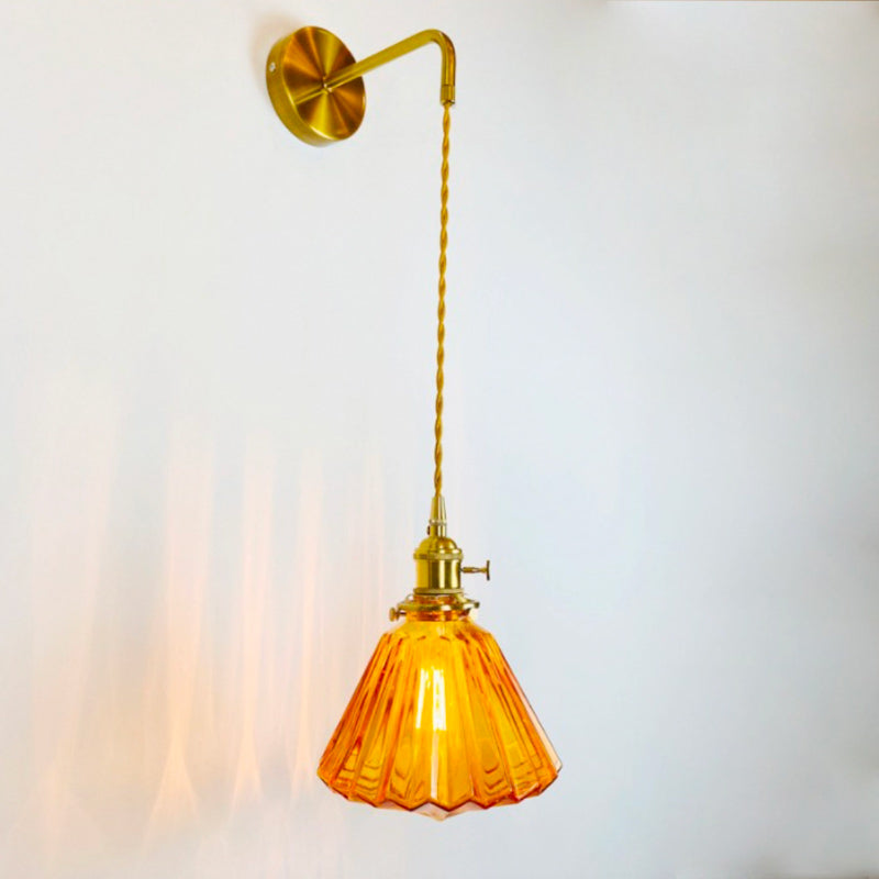 Warm, glowing light spills from the fluted amber glass, elegantly illuminating your space.