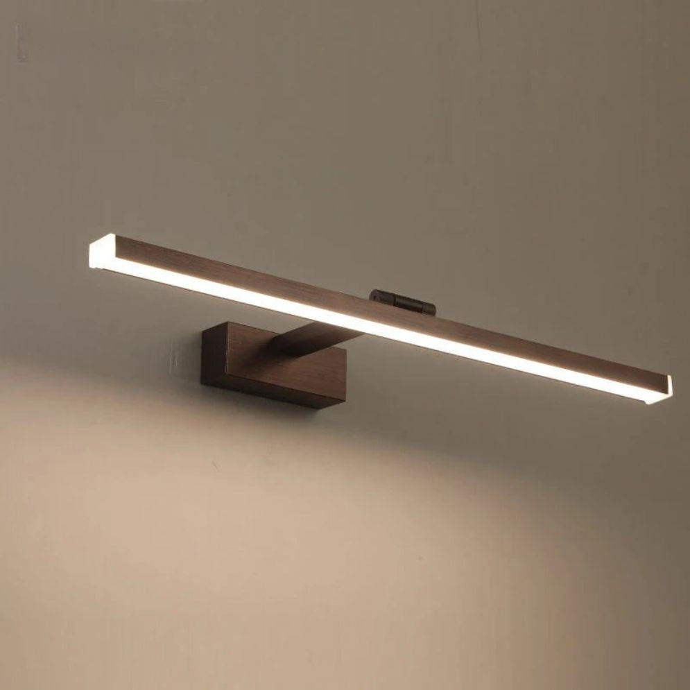 Integrated LEDs emit soft white light from a modern, sleek rectangular wall fixture.