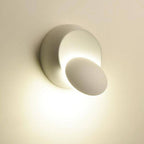 Soft, warm LED glow with unique shadows from modern circular and tilted disk design.