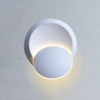 The LED wall light softly glows, illuminating the space with gentle, warm light.