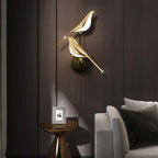 ORLUNE HOME Golden Bird Staircase Wall Light bathes the room in warm, soft illumination.